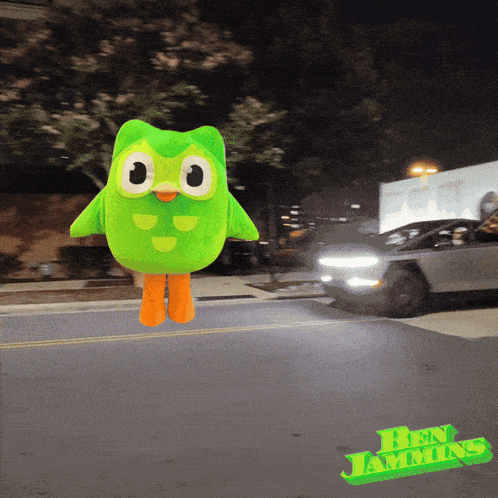 a picture of a green stuffed animal with ben jamming written on the bottom