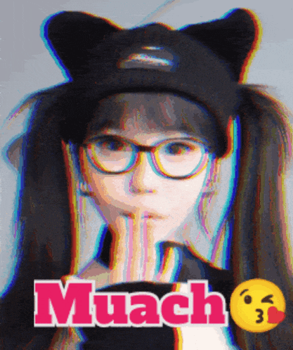 a girl wearing glasses and a black cat hat with the word muach on the bottom