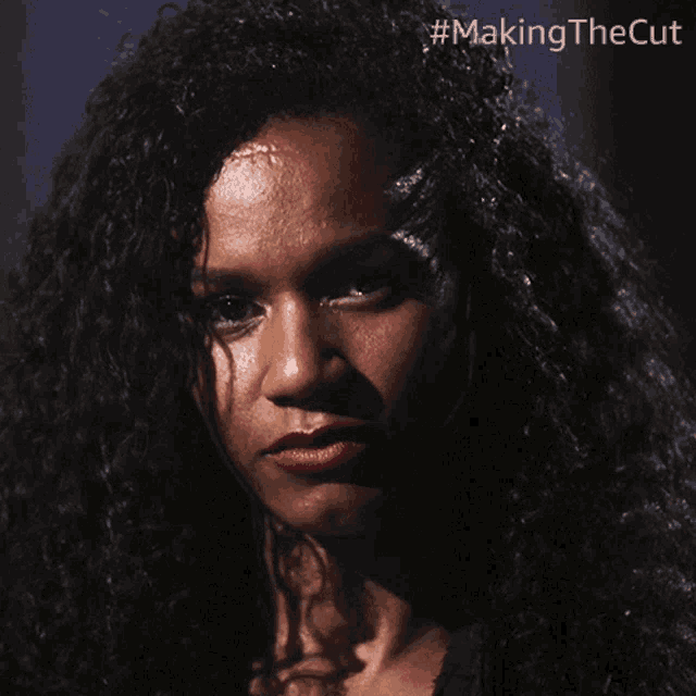 a close up of a woman 's face with #making the cut written on the bottom