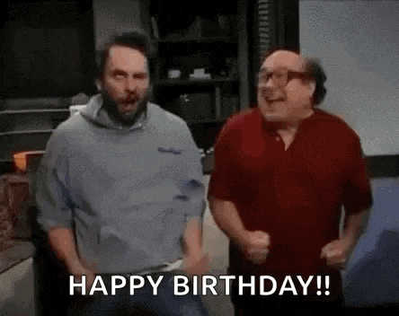 a couple of men are standing next to each other in a room .