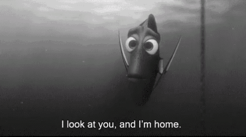 a black and white photo of a fish that says i look at you and i 'm home