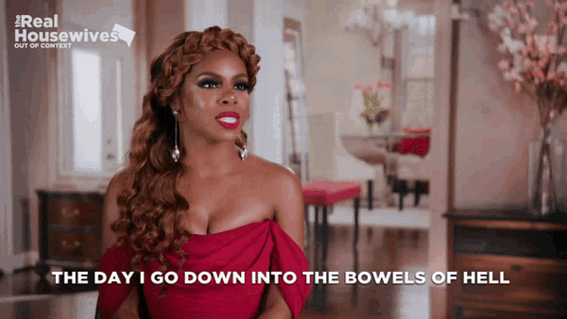 a woman in a red dress says " the day i go down into the bowls of hell "