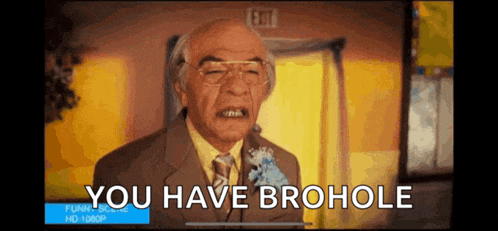 a man in a suit and tie is making a funny face and says you have brohole