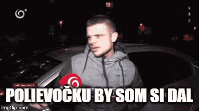 a man standing in front of a car with the words polievocku by som si dal written below him