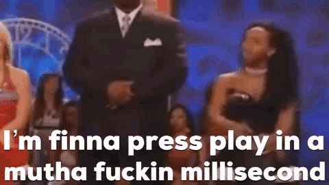 a man in a suit and tie is standing in front of a group of people and says i 'm finna press play