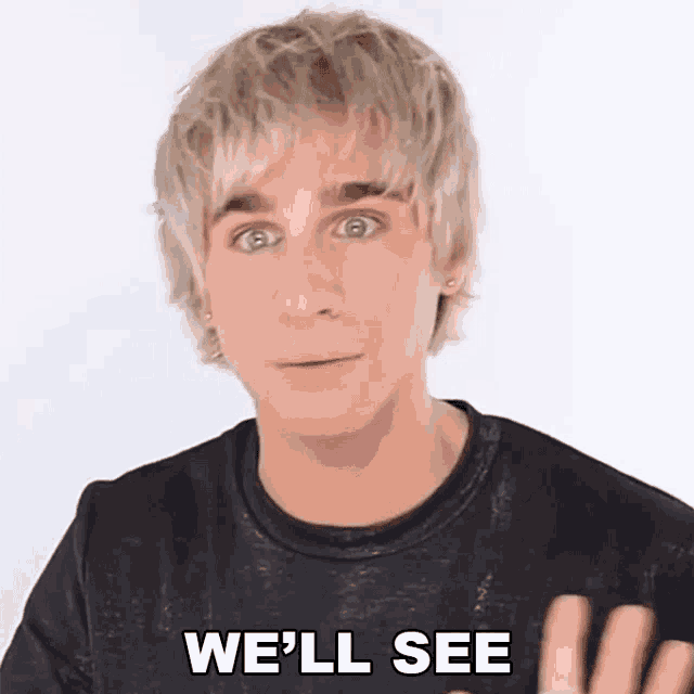 a man with blonde hair and a black shirt is saying we 'll see .