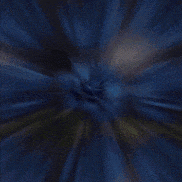 a blurred image of a person 's face with a pink and blue background