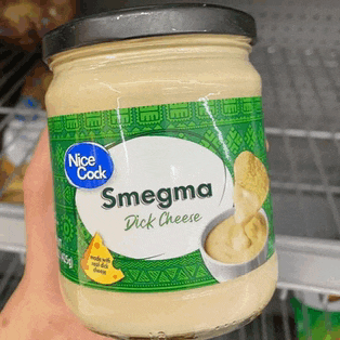 someone is holding a jar of nice cook smegma dick cheese