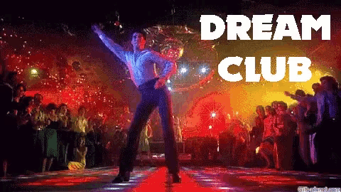 a man is dancing in front of a crowd with the words dream club written above him