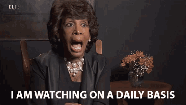 a woman says " i am watching on a daily basis " while sitting in a chair