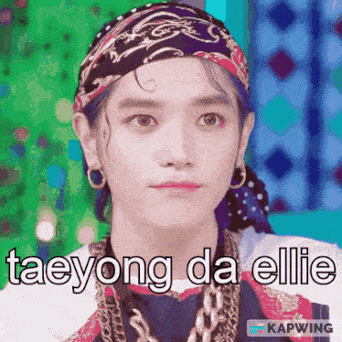 a young man with a bandana on his head and the words taeyong da ellie