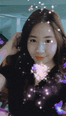 a woman with purple butterflies and stars around her