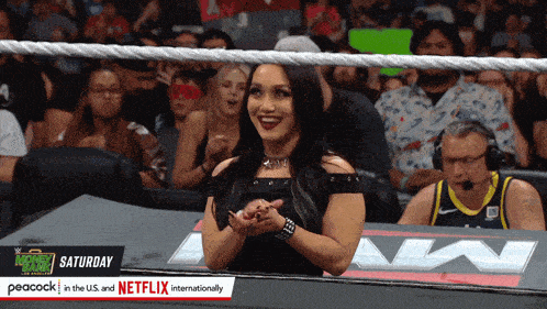 a woman sitting in a wrestling ring with peacock in the u.s. and netflix internationally at the bottom