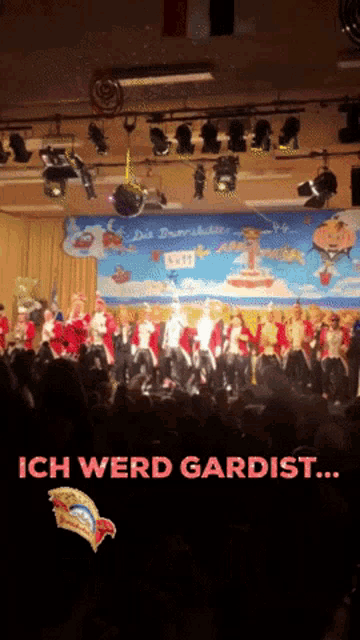 a crowd of people watching a performance with the words ich werd gardist