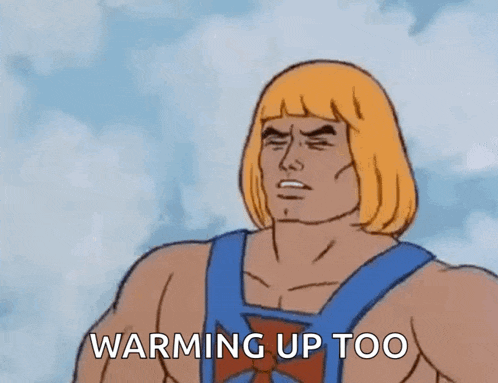 he man from the masters of the universe is standing in front of a cloudy sky and says `` warming up too '' .