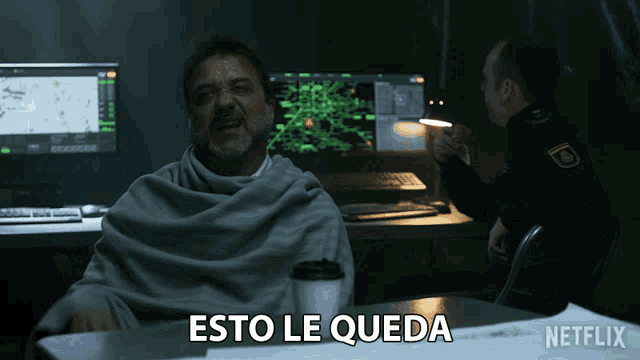 a man sitting at a table with a cup of coffee and the words esto le queda written on the bottom