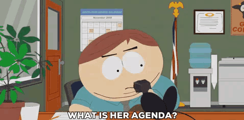a cartoon character sitting at a desk talking on a phone and says what is her agenda