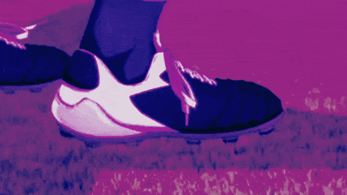 a soccer player with the number 11 on his jersey kicks the ball