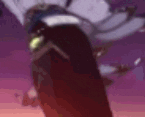a blurry picture of a person 's torso with a black background