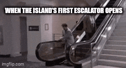 a man is riding an escalator with a caption that says when the island 's first escalator opens