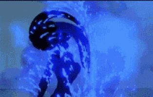 a person is standing in a pool of water with a blue background .