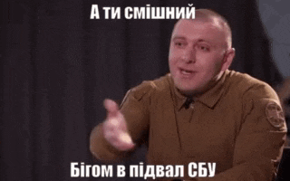 a man in a brown shirt is making a funny face in a meme