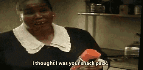 a woman is holding a spray bottle and saying `` i thought i was your snack pack . ''