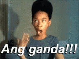 a young boy with a surprised look on his face and the words ang ganda !!! above him