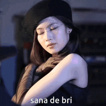a woman wearing a black hat and gloves with sana de bri written on the bottom right