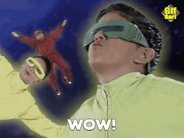 a man in a green jacket is wearing a pair of futuristic glasses and making a surprised face .