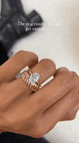 the ring combo we can 't get enough of is shown on a person 's finger