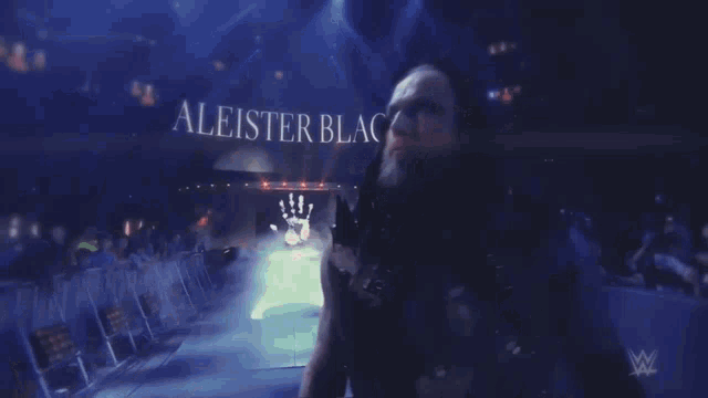 aleister black is a wrestler that has a hand on his chest