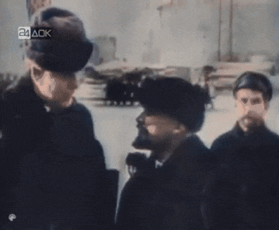a group of men are standing in front of a sign that says 24 ack