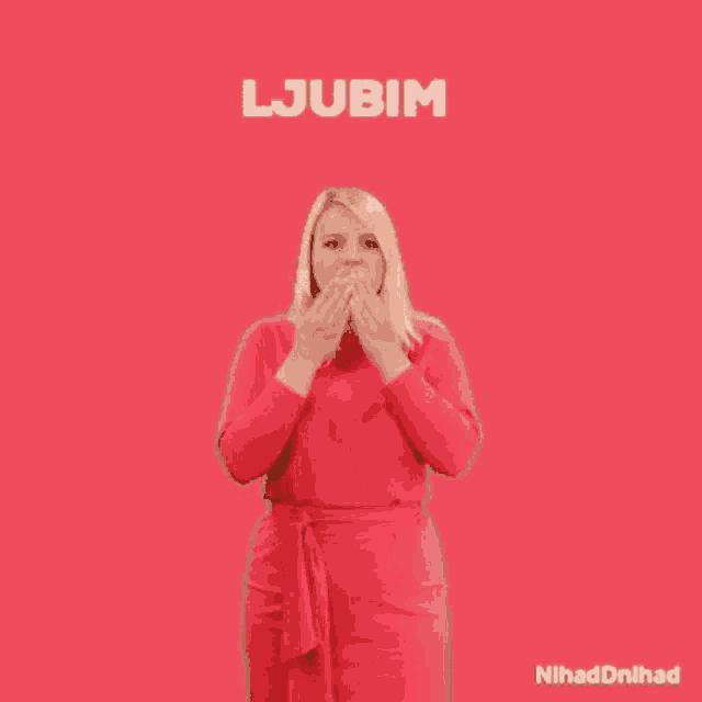 a woman in a red dress is standing with her arms outstretched and the word ljubim written above her .