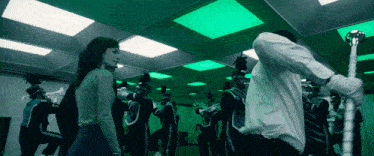 a marching band is performing in a dark room