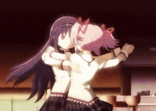 two anime girls are hugging each other in a room