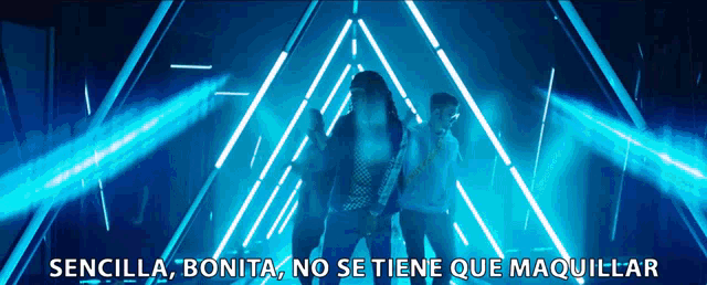 a man and a woman are dancing in a dark room with the words " sencilla bonita no se tiene que maquillar " above them