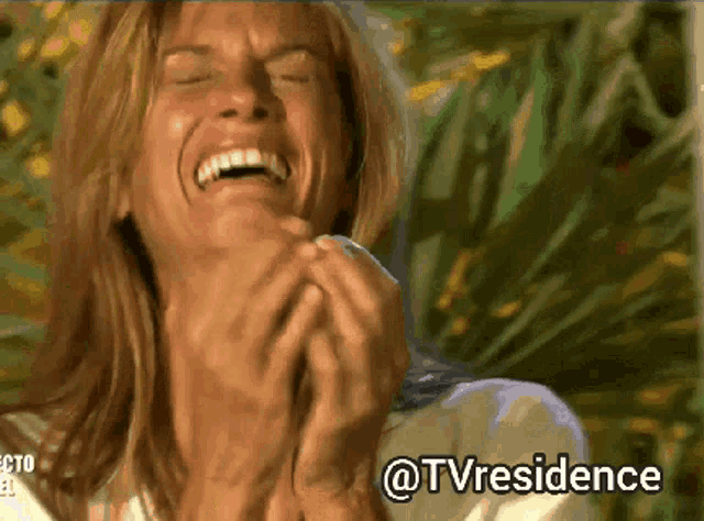 a woman is laughing with the words @tvresidence written below her
