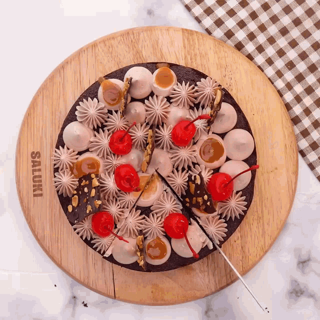 a cake on a wooden cutting board that says saluki