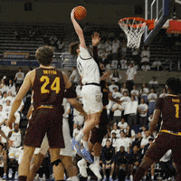 a basketball player with the number 24 on his jersey throws the ball