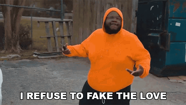 a man wearing an orange hoodie says i refuse to fake the love