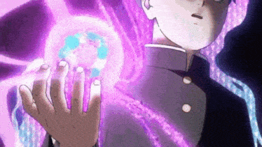 a close up of a person holding a purple ball in their hands .