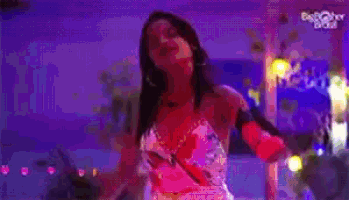 a pixelated image of a woman dancing in a club