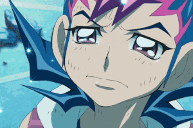 a close up of a cartoon character 's face with blue and pink hair