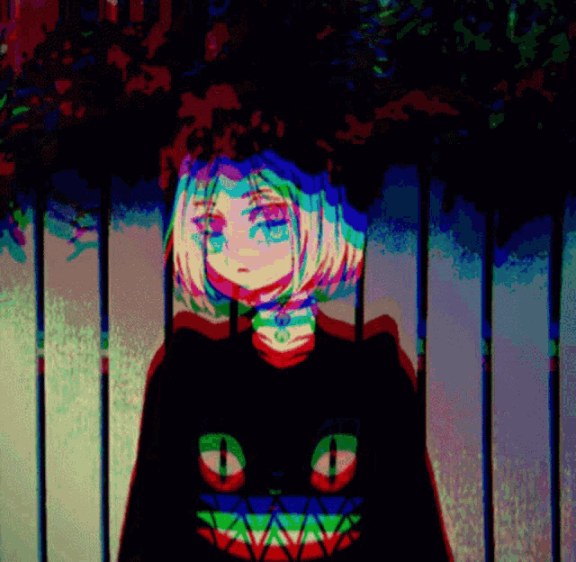 a girl with a cat on her shirt is standing in front of a fence