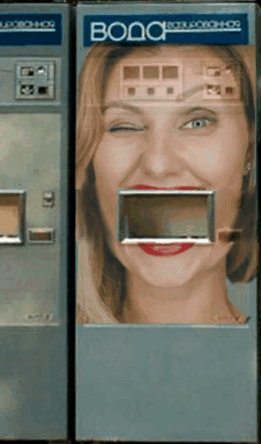 a vending machine with a woman 's face on it and the word vodo on it