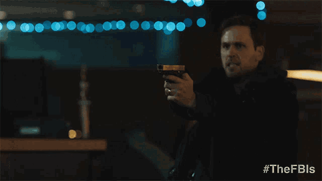 a man holding a gun with the words " stop right there " above him