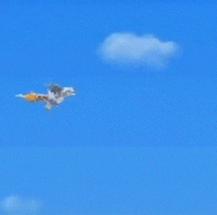 a cartoon character is flying through a blue sky with a rainbow in the background .