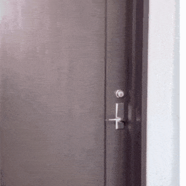 a close up of a wooden door with a key lock on it .