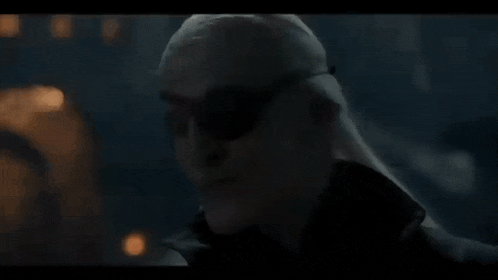 a close up of a person 's head with a hand on it